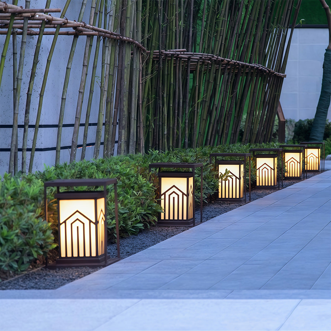 Lantern light illuminating a lush garden, providing a charming and serene outdoor lighting effect.