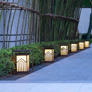 Lantern light illuminating a lush garden, providing a charming and serene outdoor lighting effect.