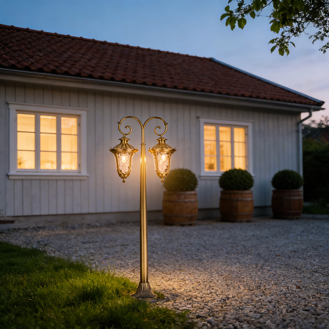 Charming path lighting outdoor beside a cozy home, casting a gentle glow on the gravel pathway.