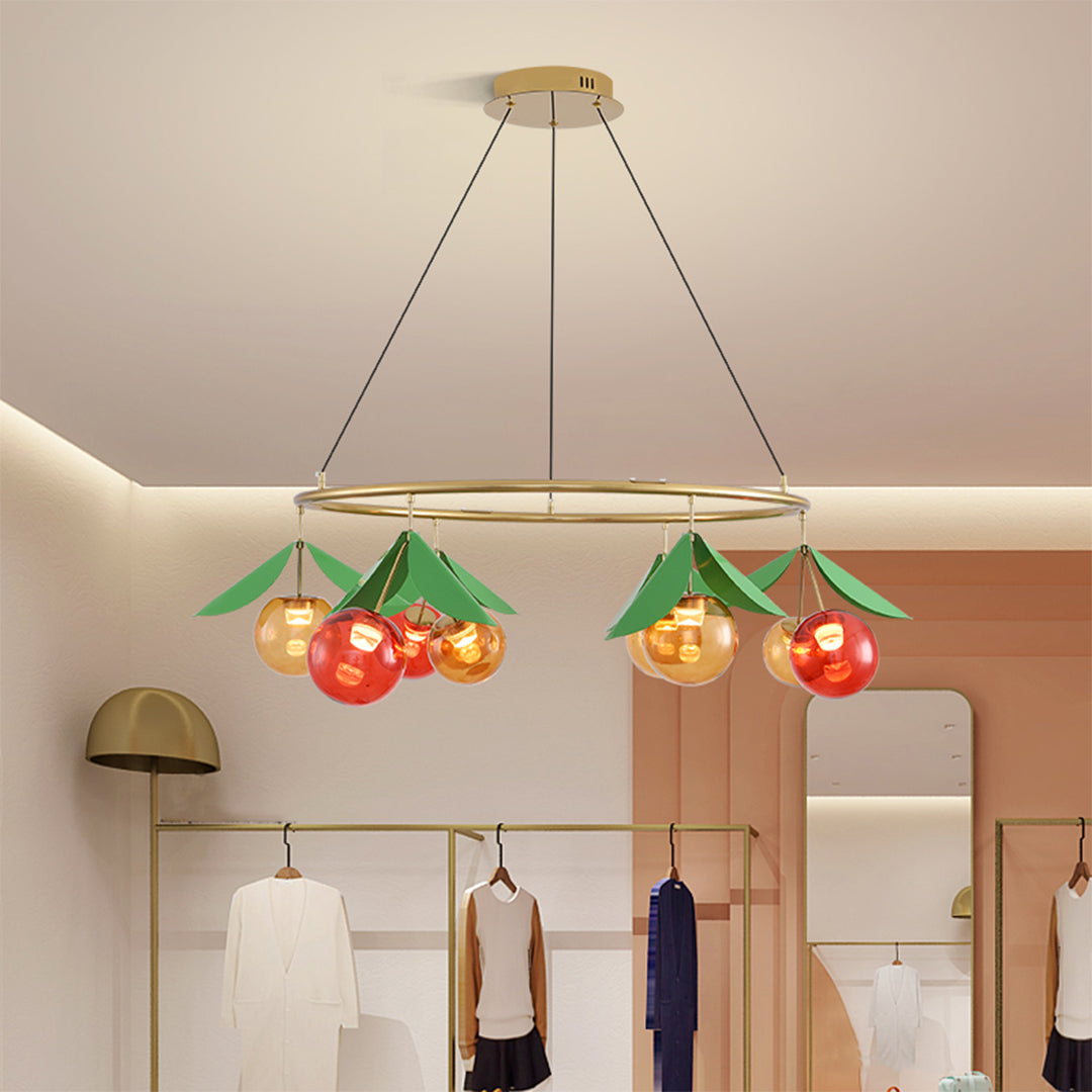 Cherry-inspired chandelier providing ambient lighting in contemporary kitchen with warm wood tones