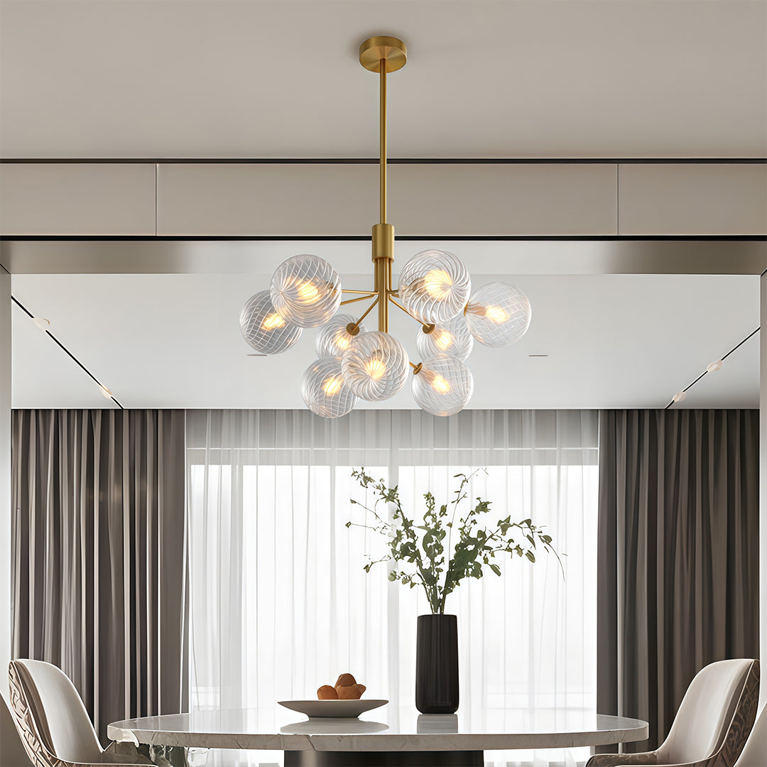 Chic luxury modern chandeliers with a gold frame, enhancing the ambiance of a luxurious dining room.