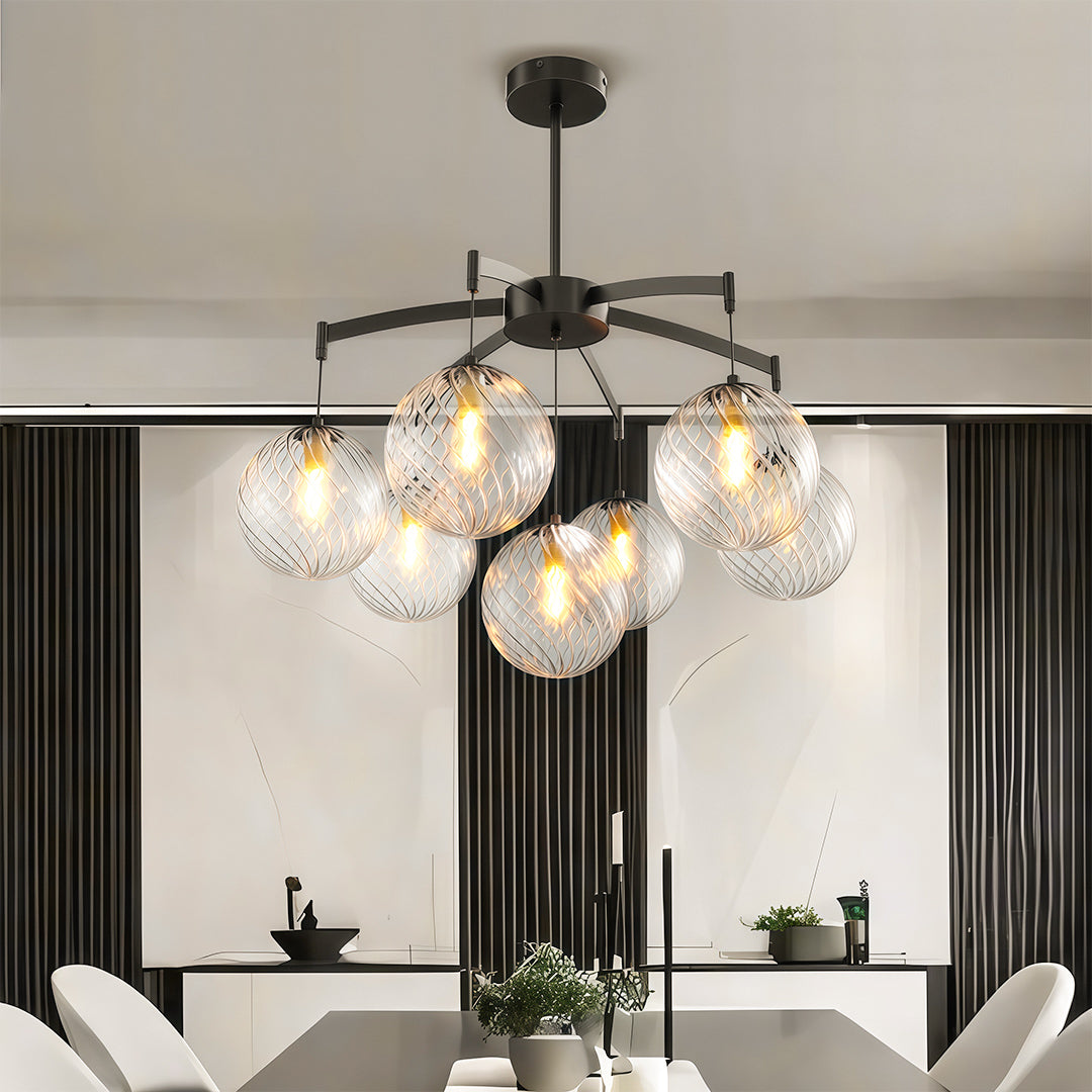 Chic modern glass ball chandelier with a black frame, enhancing the elegance of a modern dining room.