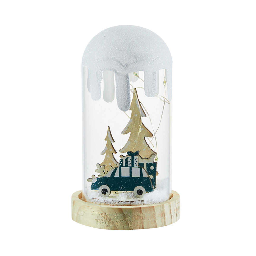 Christmas truck and tree scene inside a snowy dome styled like a decorative white glass table lamp.