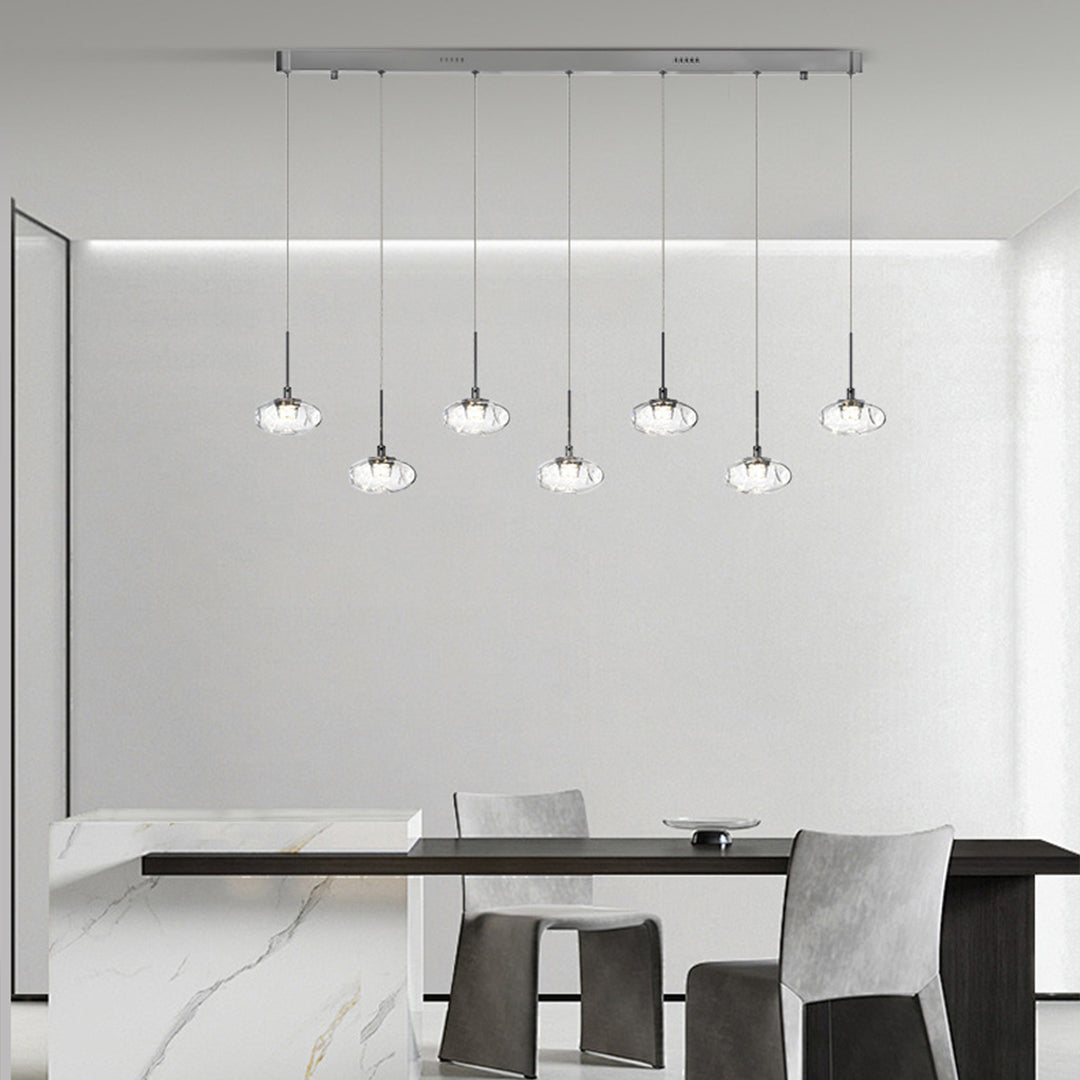 Sophisticated multi light pendant lighting with chrome canopy creating stunning focal point above contemporary dining table