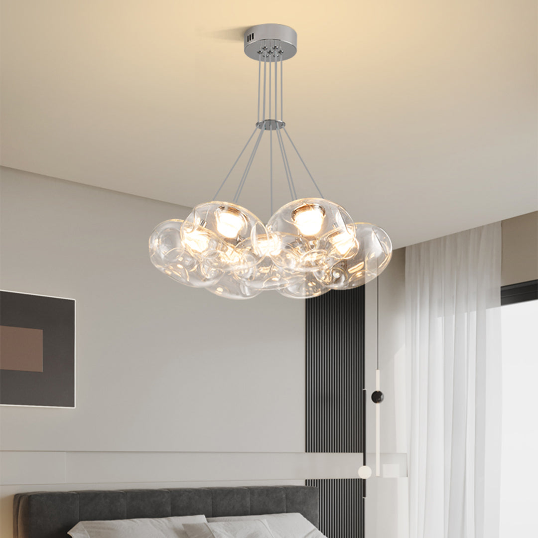 Multi light chandelier with chrome finish displaying multiple glass spheres in contemporary home environment