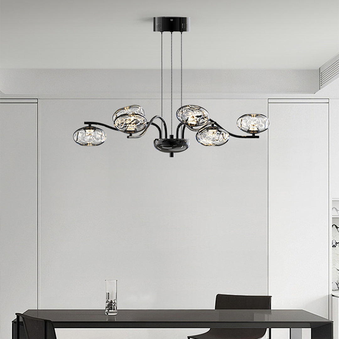Stylish modern LED chandelier with chrome finish providing elegant illumination in minimalist white interior