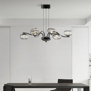 Stylish modern LED chandelier with chrome finish providing elegant illumination in minimalist white interior