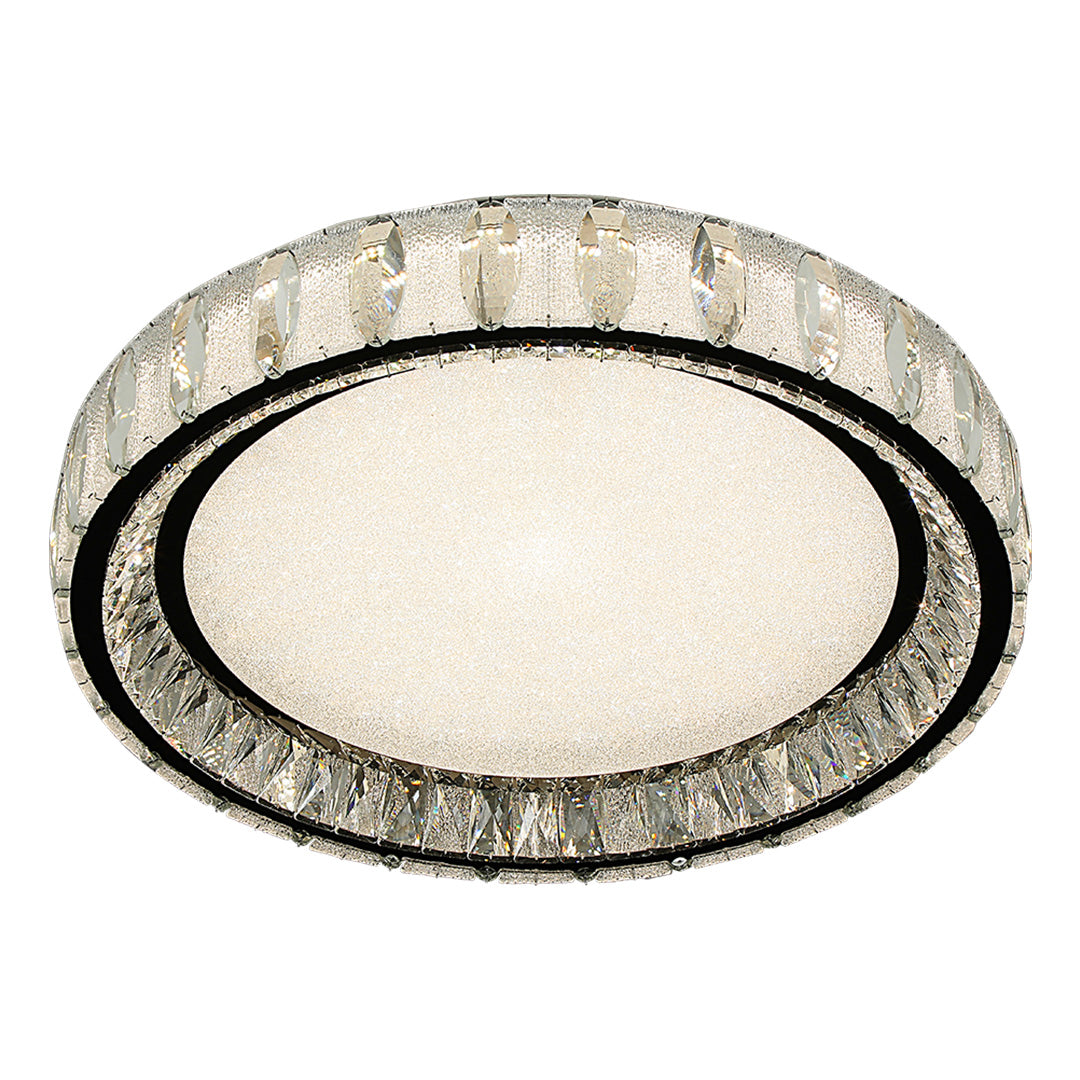 Chrome flush mount light installed in a modern living room, providing warm and inviting illumination.