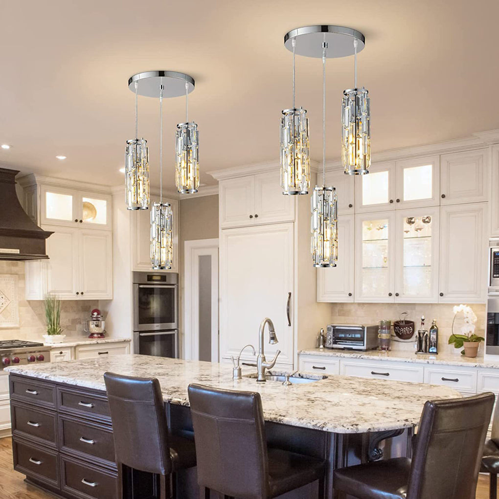 Chrome mini crystal pendant lights arranged above a granite kitchen island.