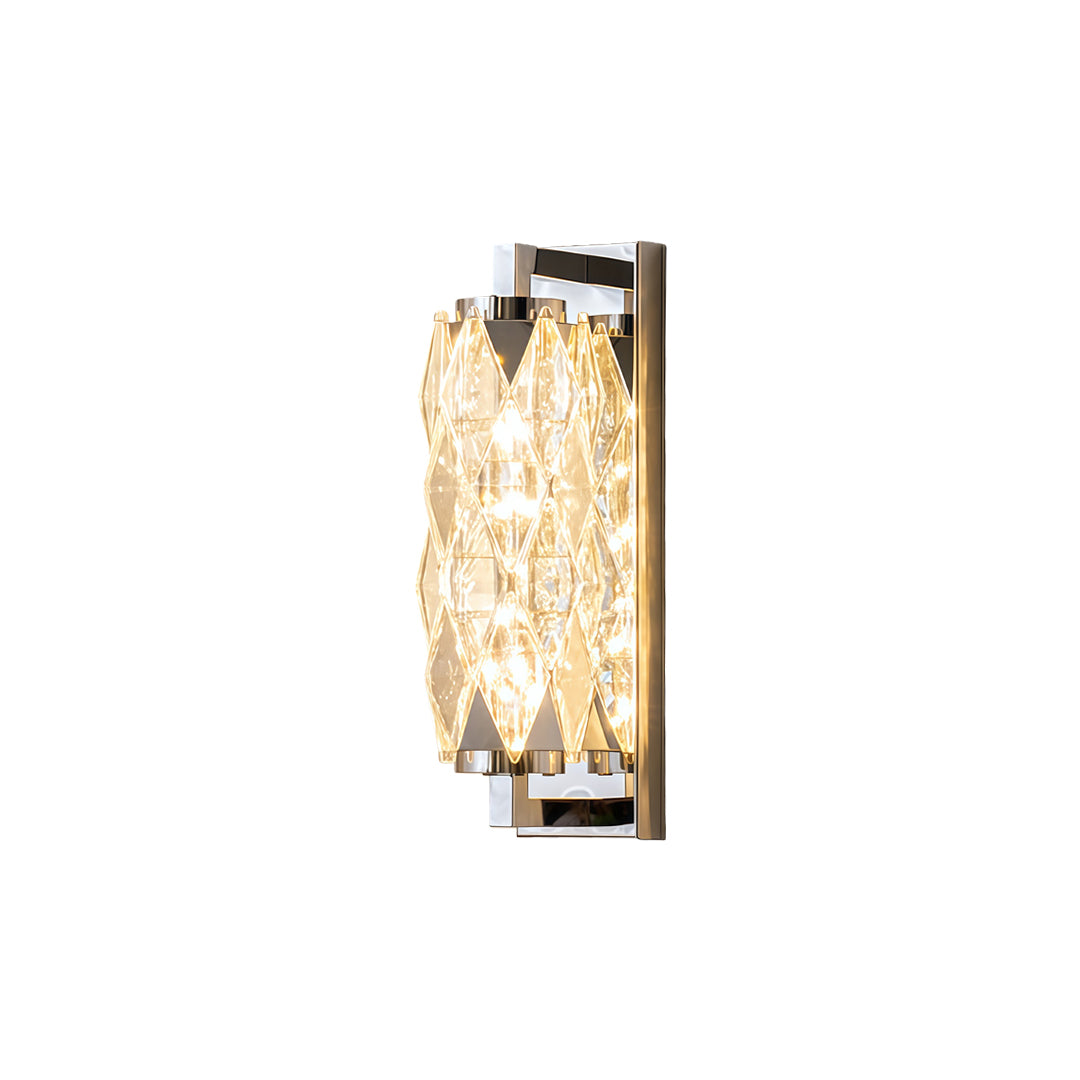 Chrome modern wall light with rectangular crystal glass shade creating vertical illumination on white background.