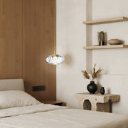 Small glass pendant lights with chrome mount providing elegant accent lighting in minimalist bedroom space