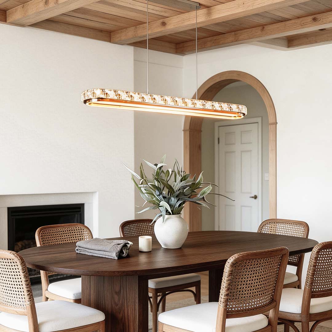 Chrome pendant lights enhancing a classic dining room with warm illumination.