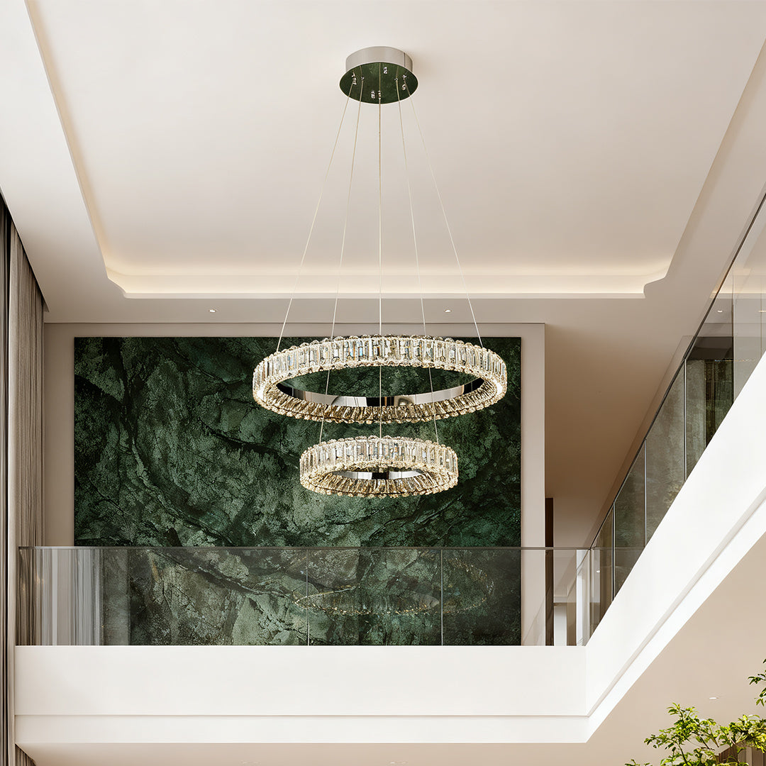 Circle chandelier in a modern interior with marble walls, providing stylish illumination.