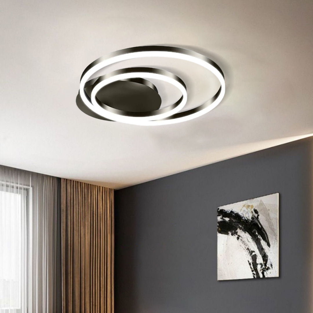 Modern circular ceiling light installed in contemporary living room with stylish decor