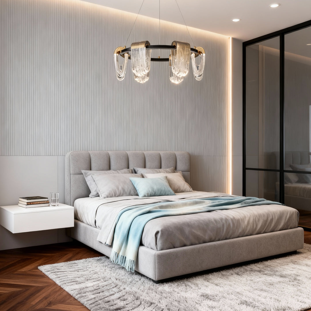 Modern circular chandelier modern fixture installed in a contemporary bedroom with soft neutral décor.