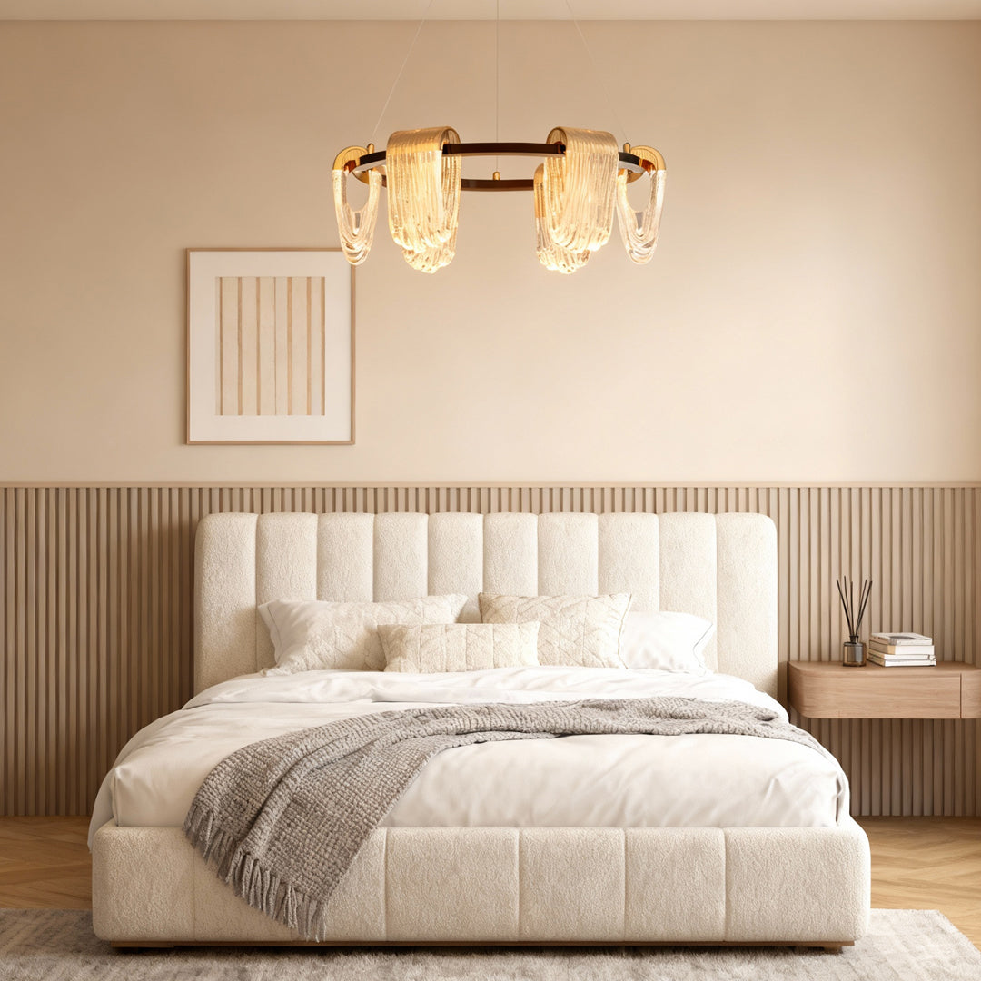 Circular chandelier modern lighting adding warm elegance to a cozy bedroom interior.