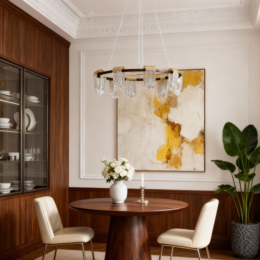 Stylish circular chandelier modern fixture enhancing a dining room with gold and crystal accents.