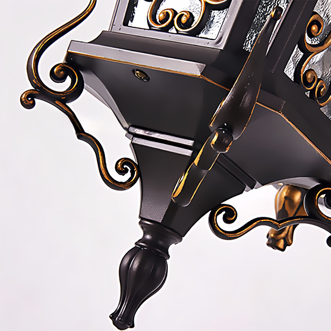 Classic antique outdoor wall sconce featuring intricate metal detailing and frosted glass panels.