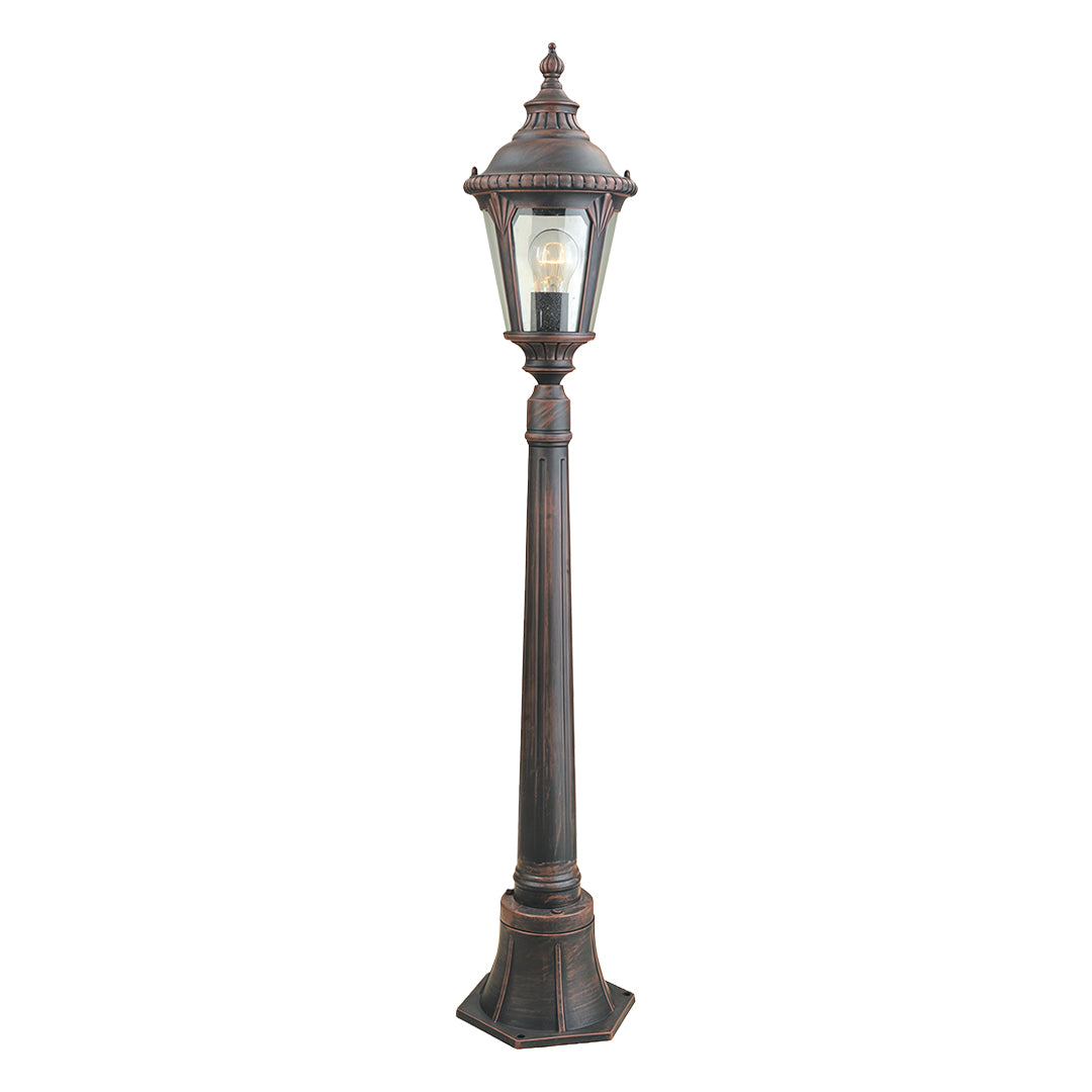 Classic decorative bollard light featuring ornate top and frosted glass on white background