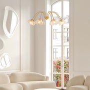 Classic glass shades chandelier featured in traditional dining room with warm wood accents