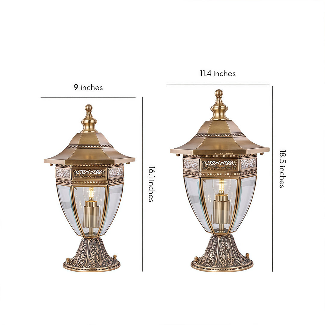 Two classic gold-toned glass pillar lights with intricate metal frames, perfect for vintage-style outdoor illumination.