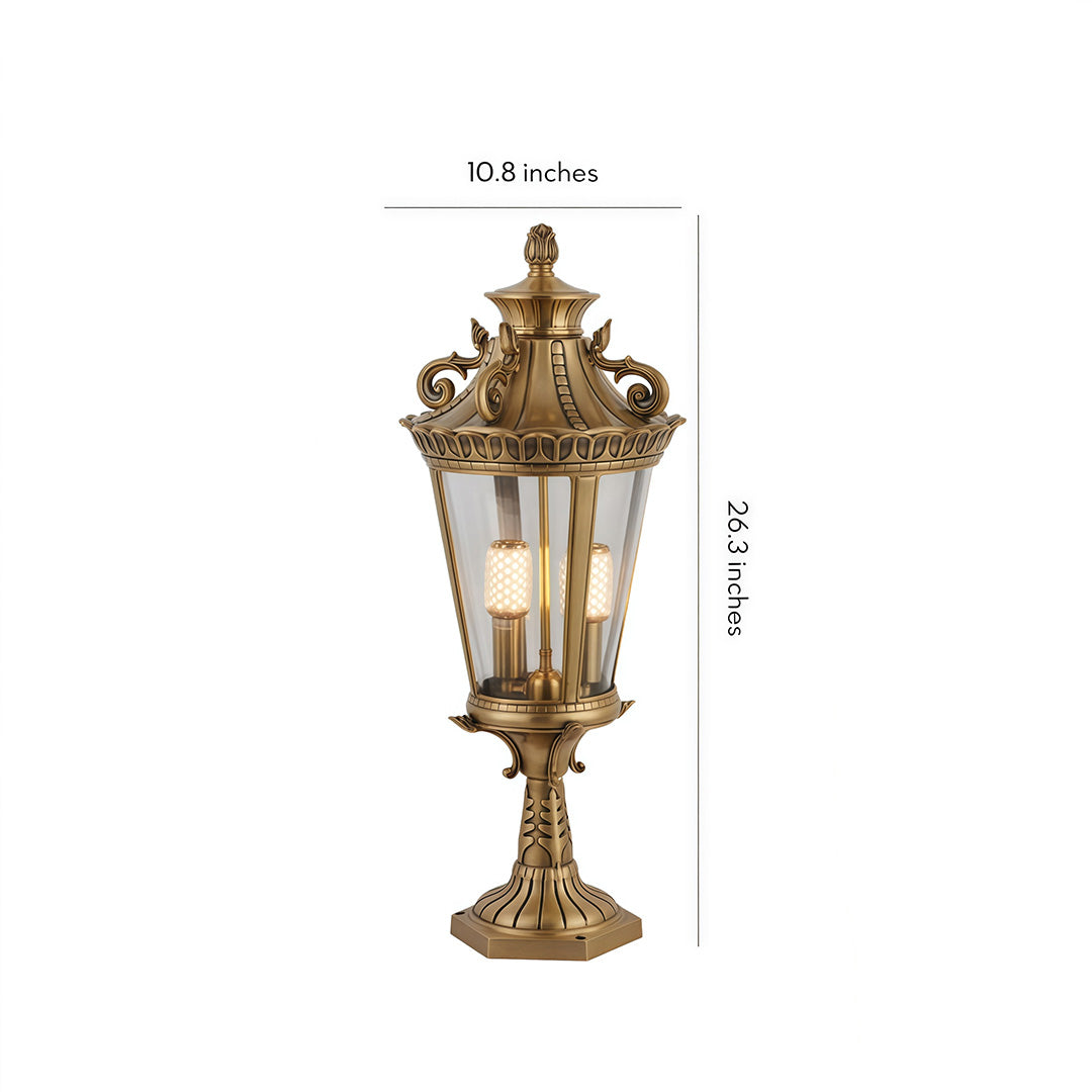 Classic gold-finished glass pillar lights with intricate vintage design, perfect for elegant outdoor settings.