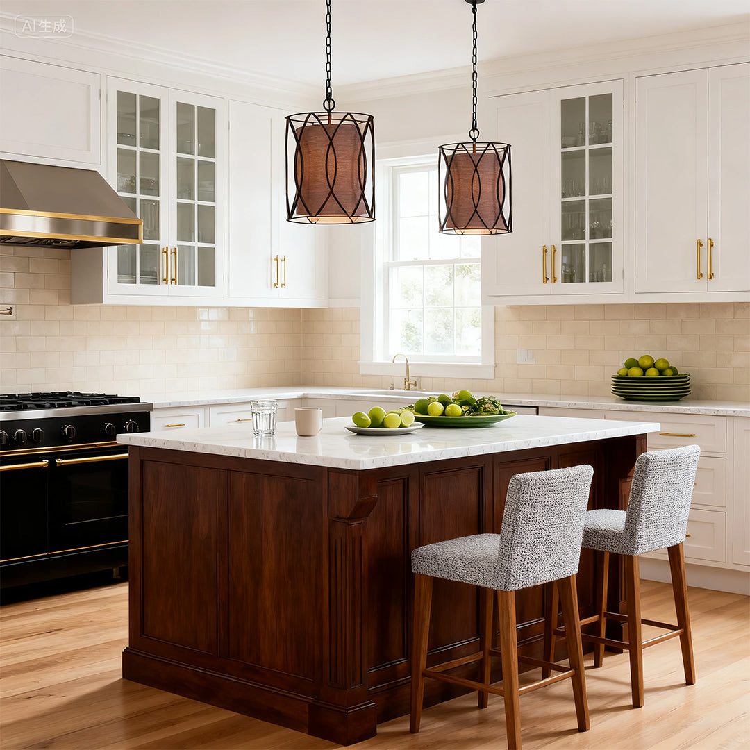 Classic kitchen design with two matching small black pendant light fixtures providing task lighting over a marble-top dark wood island.
