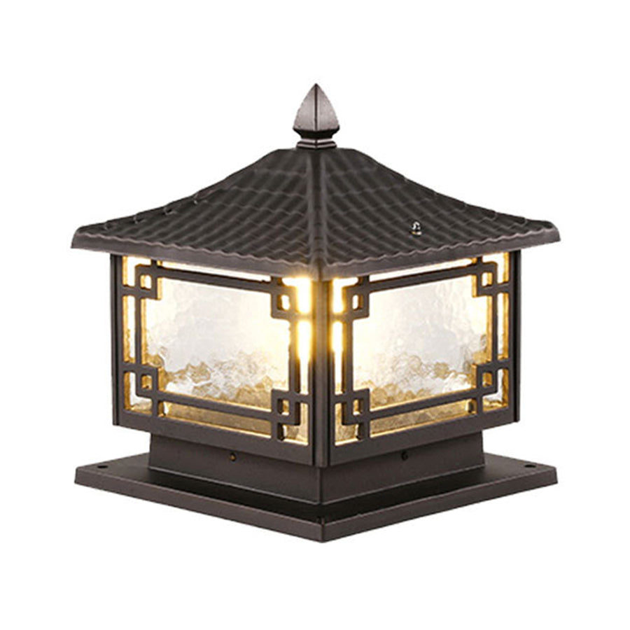 Classic metal outdoor garden pillar light with traditional lantern styling and warm glowing illumination