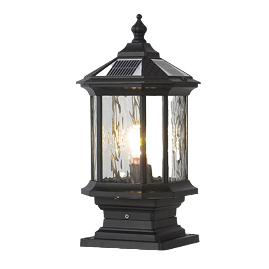 Classic outdoor pillar light with transparent glass housing and traditional black metal framework