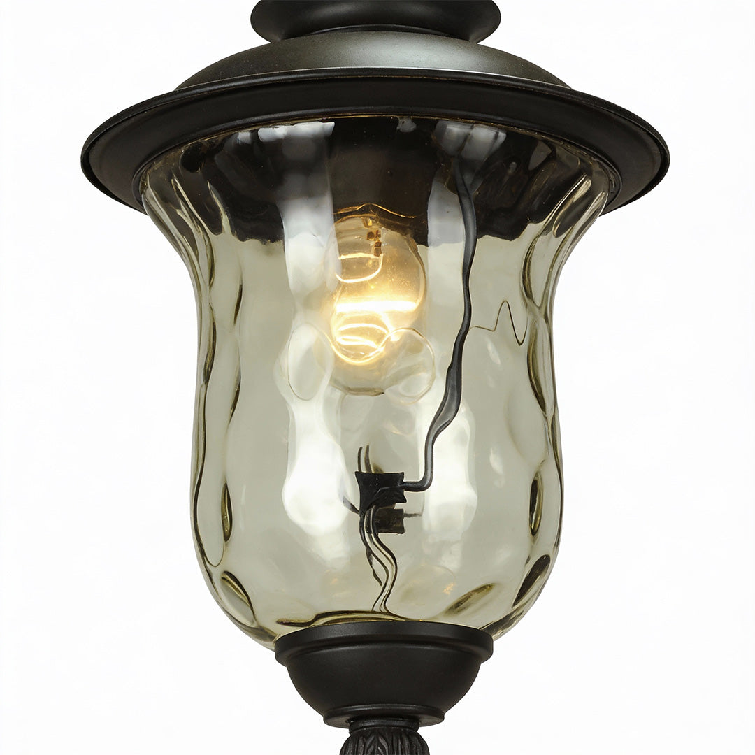Classic industrial metal pendant light featuring clear ribbed glass shade and warm Edison bulb for cozy ambiance.