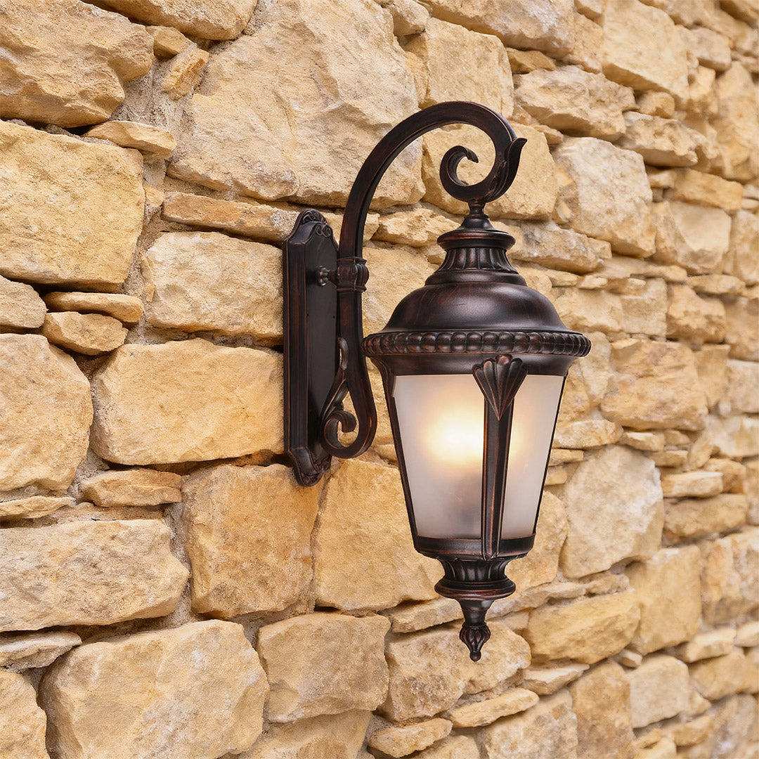 Classic vintage outdoor wall sconce mounted on natural stone wall creating elegant illumination