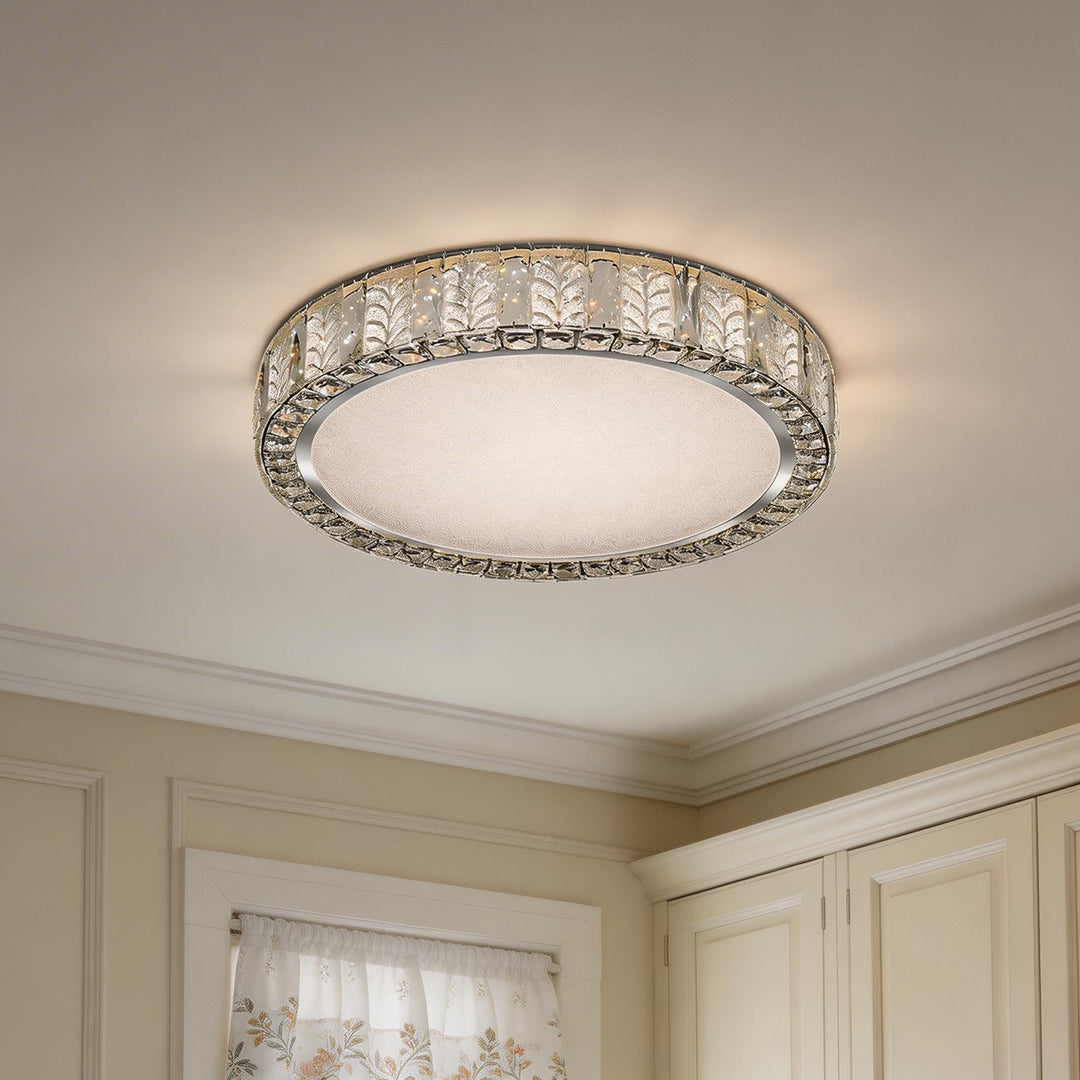 The modern gold flush mount ceiling light shines brightly in a classic white ceiling setting.