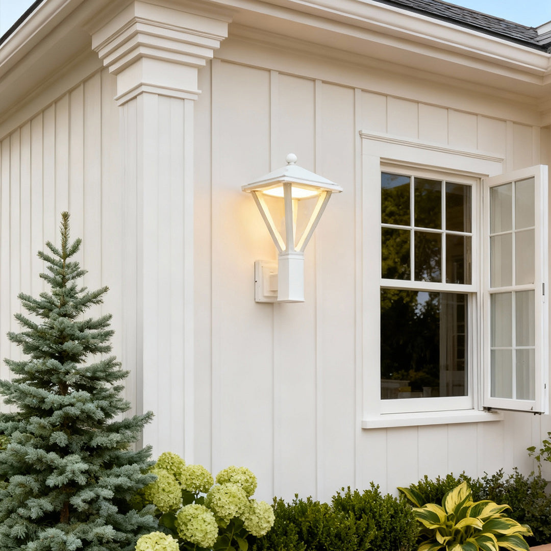 Classic lantern-shaped outdoor wall light mounted near a window, offering bright illumination and enhancing traditional wall mounted lights outdoor.