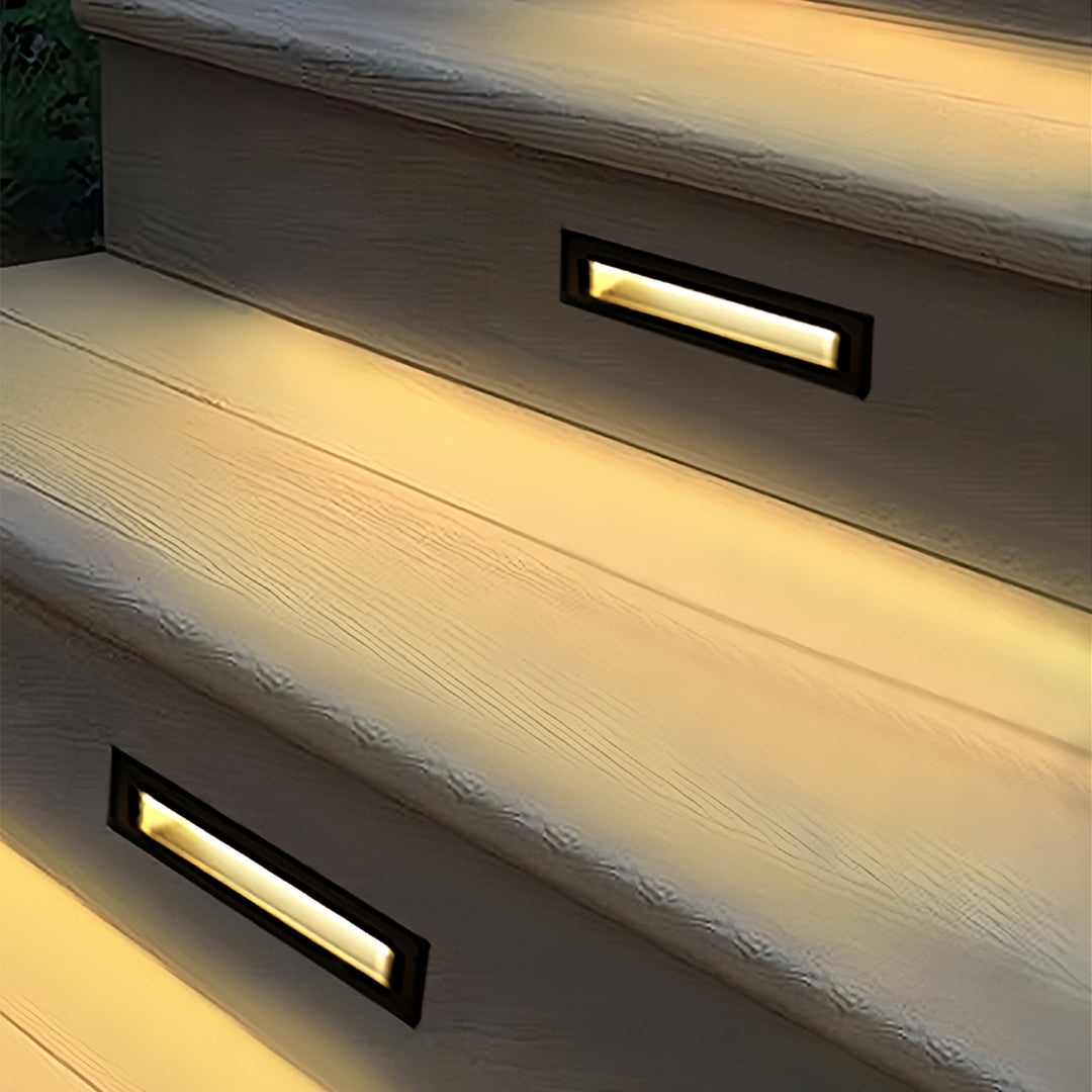White deck lights for steps demonstrating clean installation in contemporary home exterior