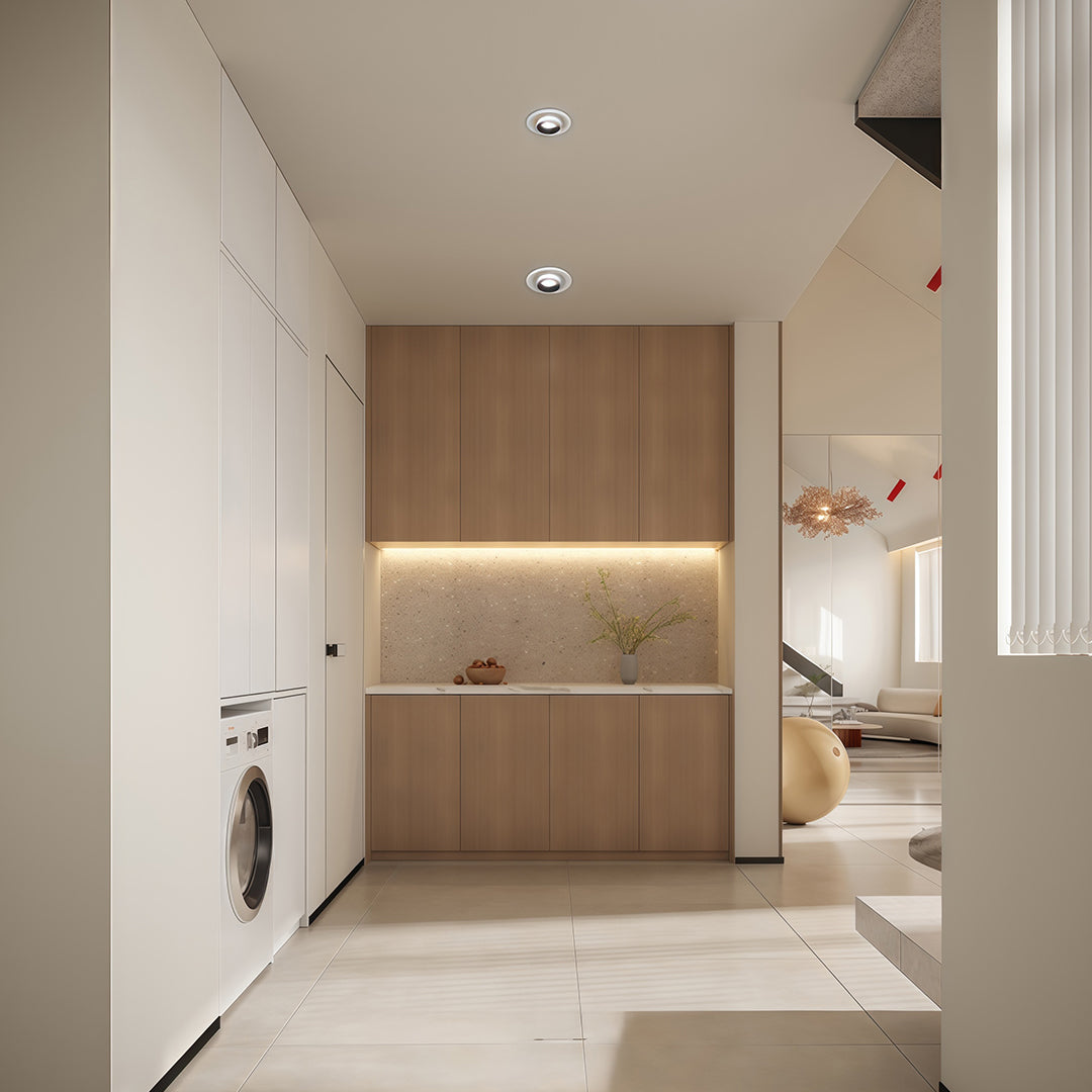 Clean illumination from led ceiling downlights in a contemporary laundry room with wood cabinets.