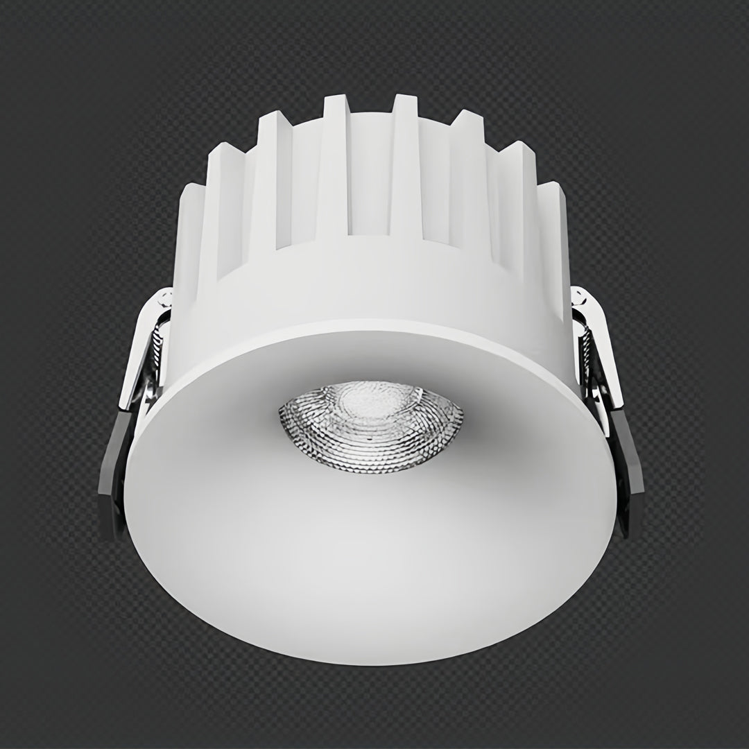 Clean trimless recessed downlight installed in ceiling with flush white finish and LED center