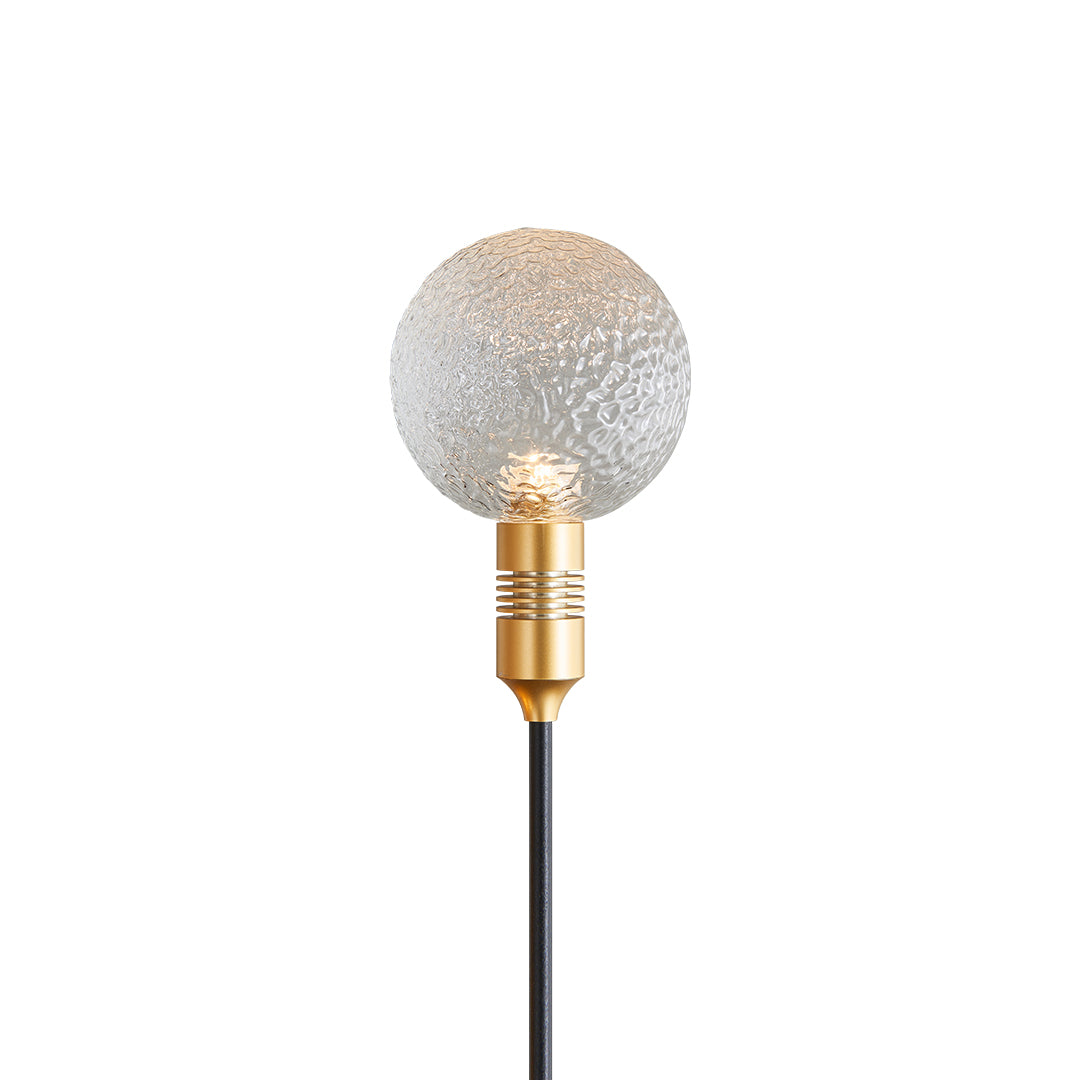 Clear crackle-glass globe stake light offering soft ambient path landscape lighting.