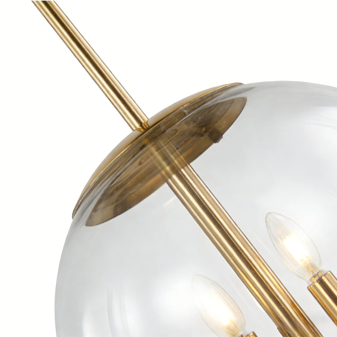 Clear globe pendant light featuring transparent glass shade with brass support rod and visible bulbs, highlighting modern decorative lighting style.