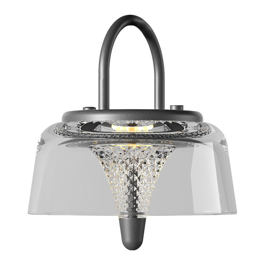 Clear pendant light with a geometric pattern, creating a modern and artistic outdoor lighting feature.