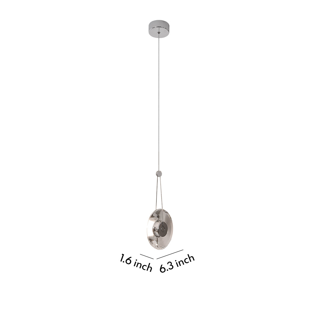 Single clear pendant light with chrome accent, ideal for modern minimalist interiors.