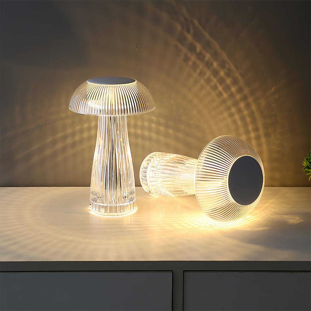 Collection of clear table lamps creating dramatic lighting display with shadow patterns