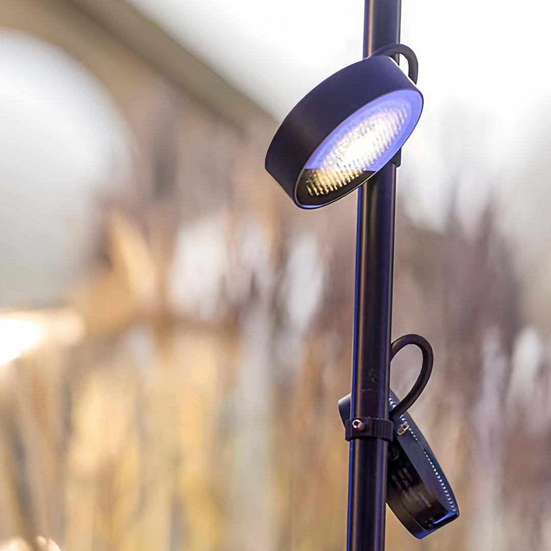 Close-up of an adjustable black spot head pathway landscape lights, showing the focused LED light beam used for accentuation.