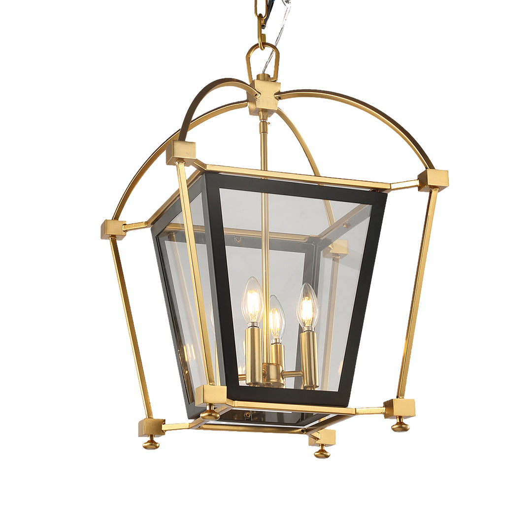 Close-up of the gold lantern pendant light, highlighting the arched top supports and the detailed brass finials on the corners.