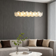 Close-up of artistic glass chandeliers, showcasing intricate glasswork and elegant gold detailing