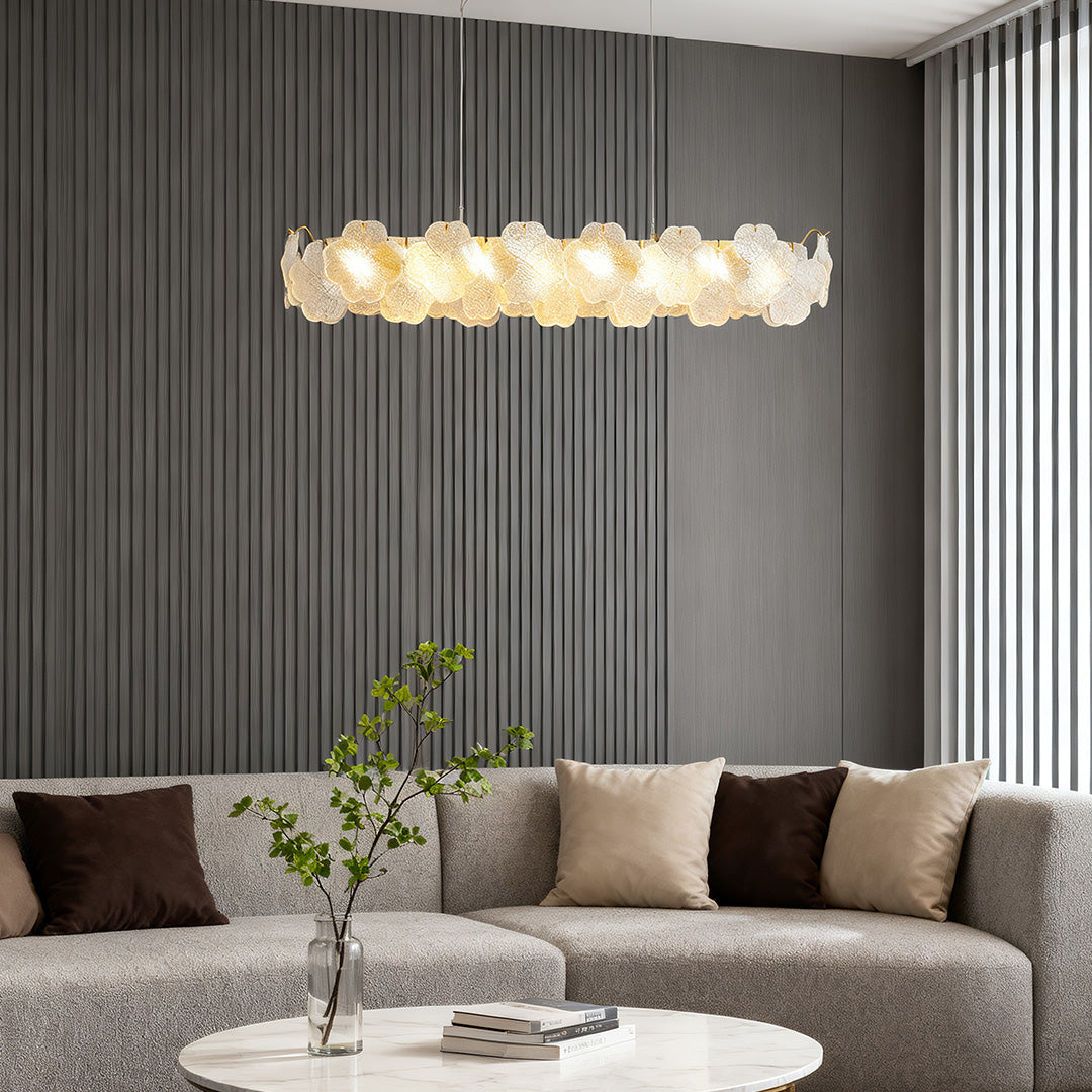 Close-up of artistic glass chandeliers, showcasing intricate glasswork and elegant gold detailing