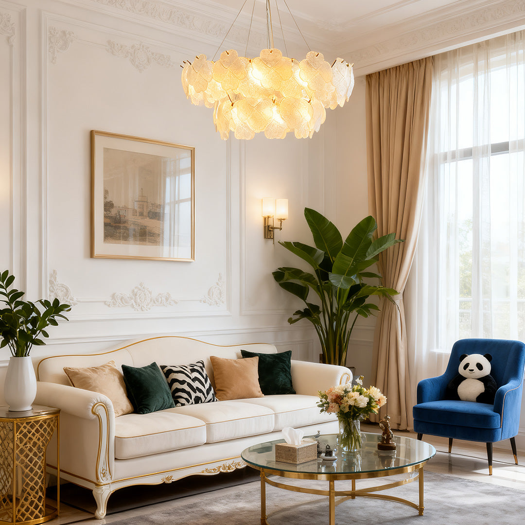 Close-up of artistic glass chandeliers, showcasing intricate glasswork and elegant gold detailing