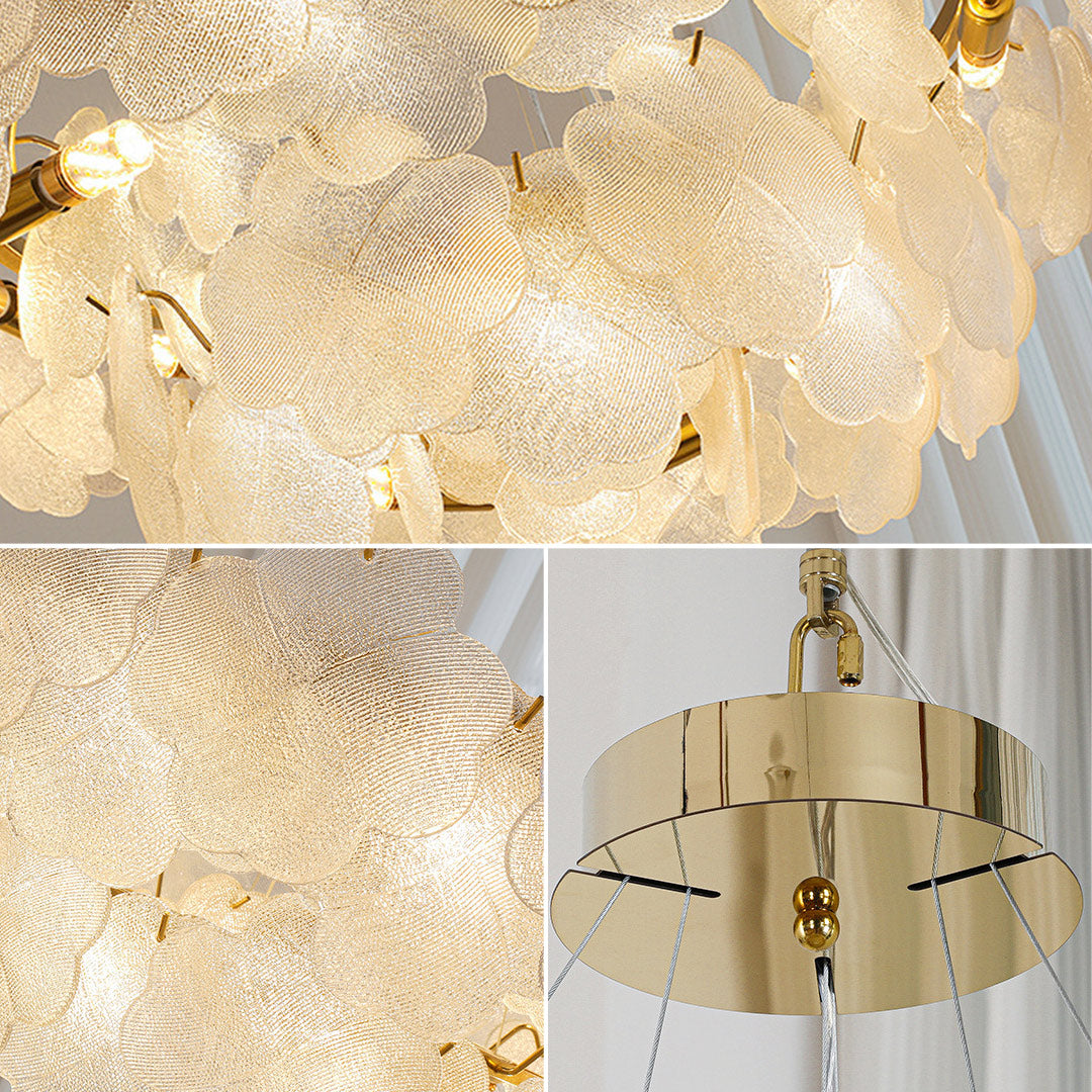 Close-up of artistic glass chandeliers, showcasing intricate glasswork and elegant gold detailing
