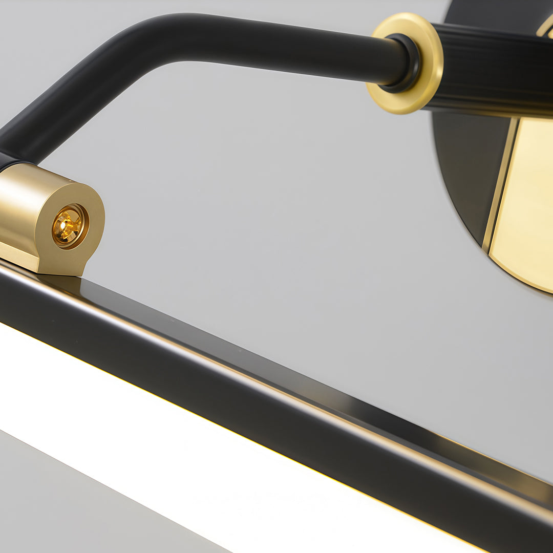 Close-up of a black and gold bathroom vanity LED light, highlighting the gold switch and elegant design.