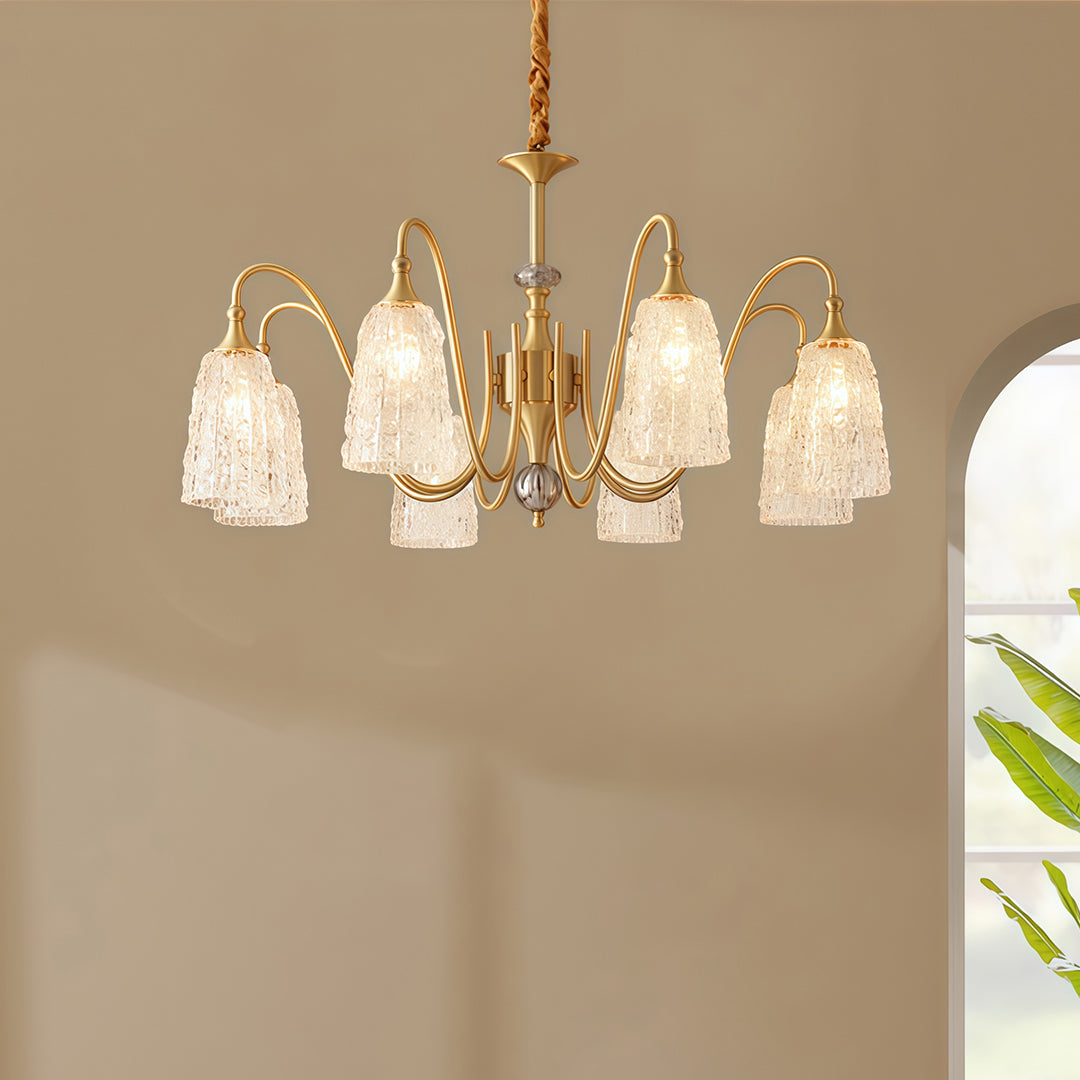 Brass vintage chandelier with a close-up of the top, showcasing the intricate brasswork and crystal accents.