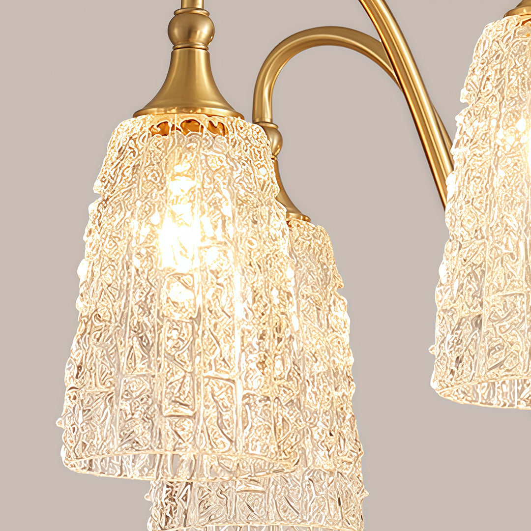 Brass vintage chandelier with a close-up of the top, showcasing the intricate brasswork and crystal accents.
